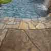 Quartz stone coping and stamped concrete